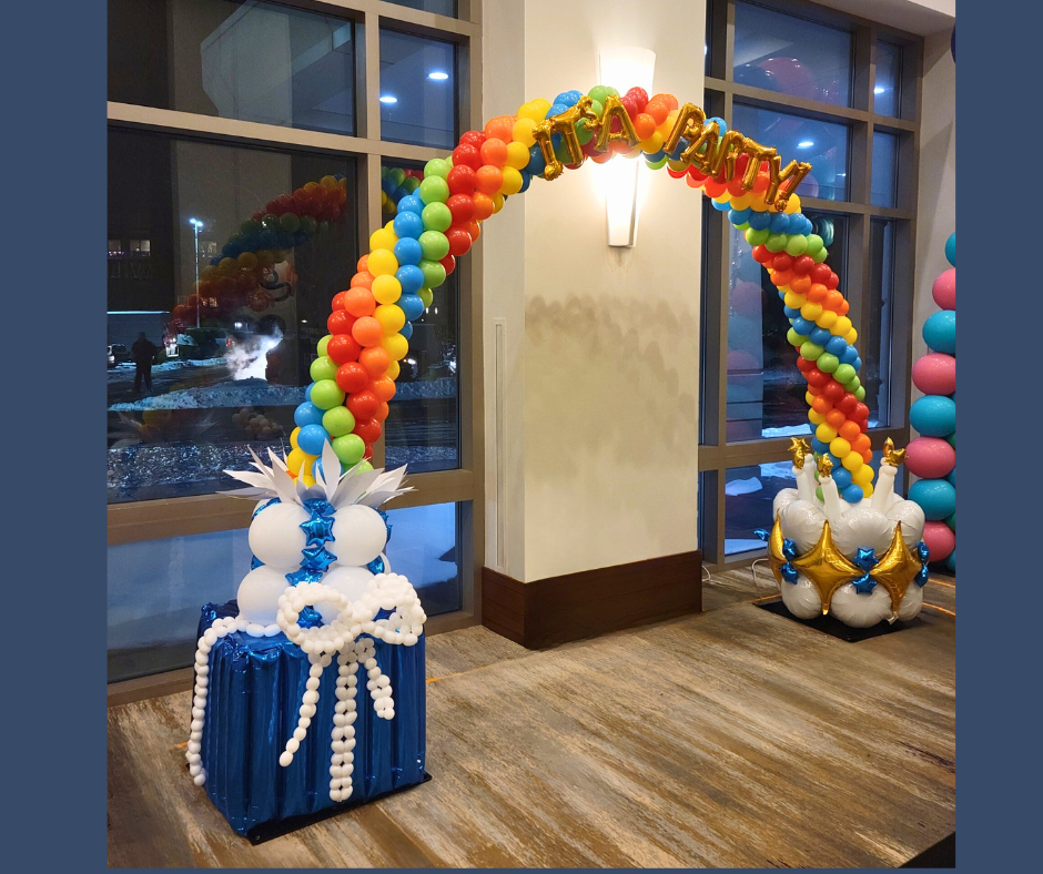 A colorful balloon arch with a blue gift box, for a birthday party.