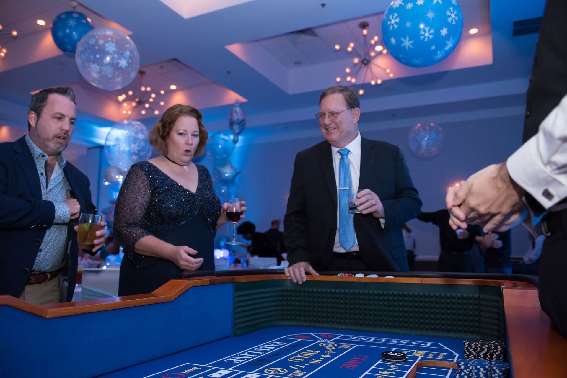 A group of people are playing roulette at a party.