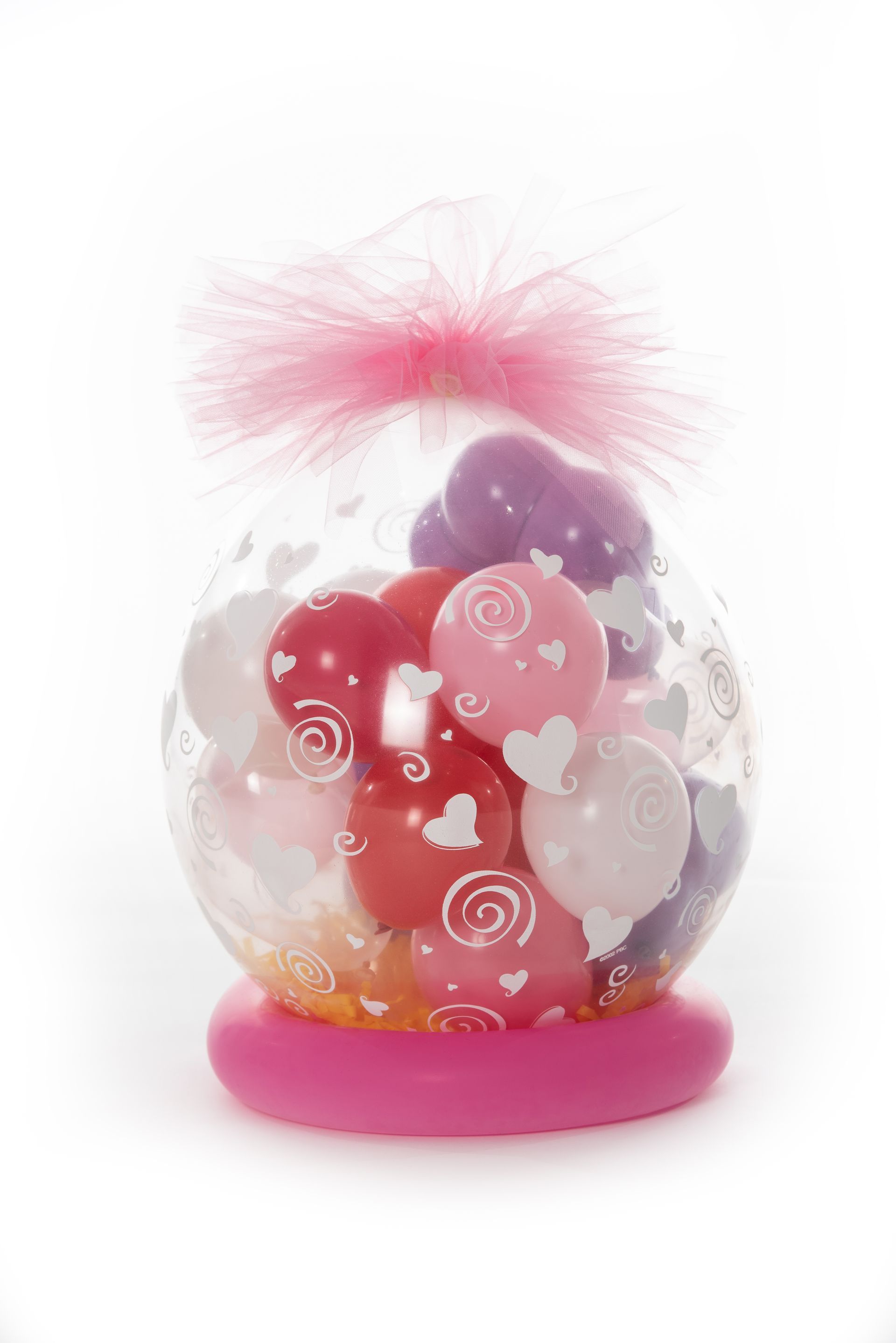 A balloon filled with balloons and hearts on a pink base.