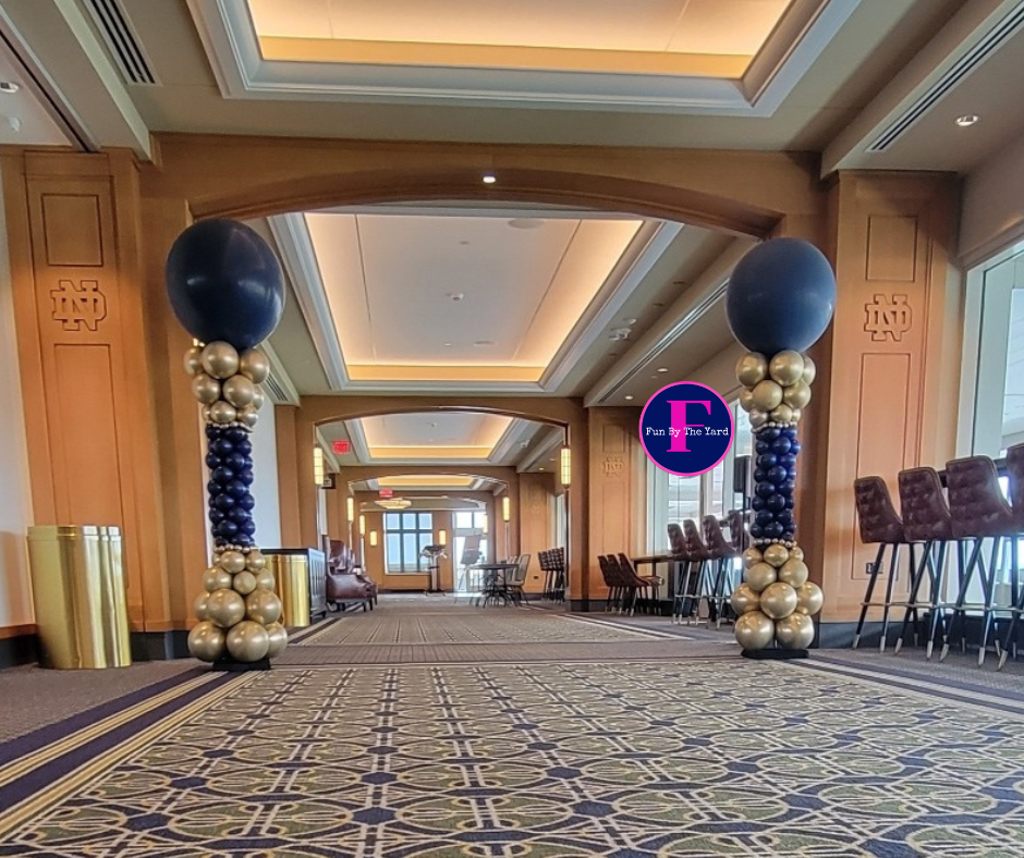 A hallway with balloons and a sign that says ' ucsd ' on it