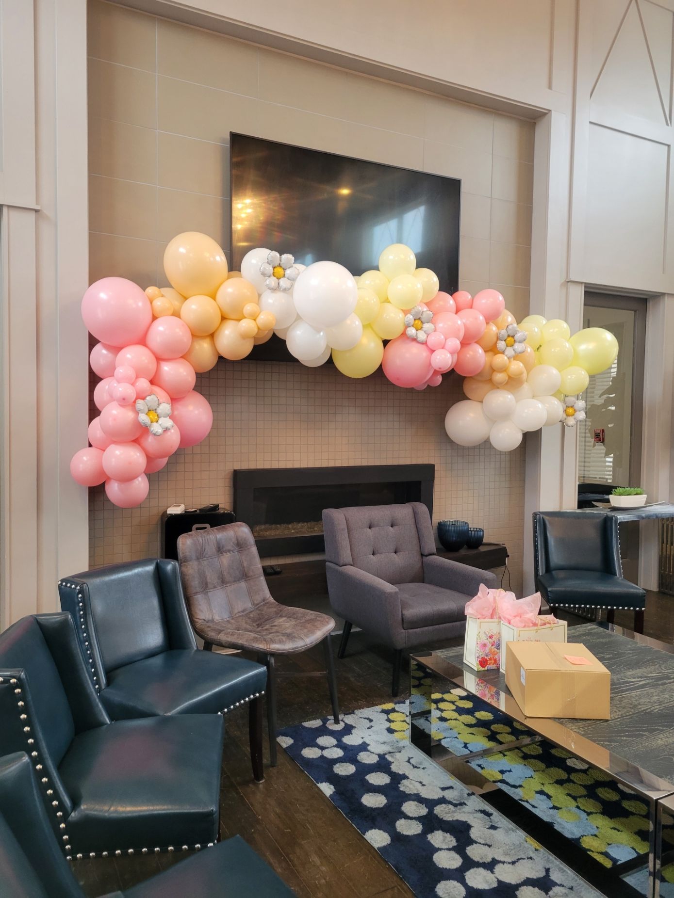 A living room filled with furniture and balloons.