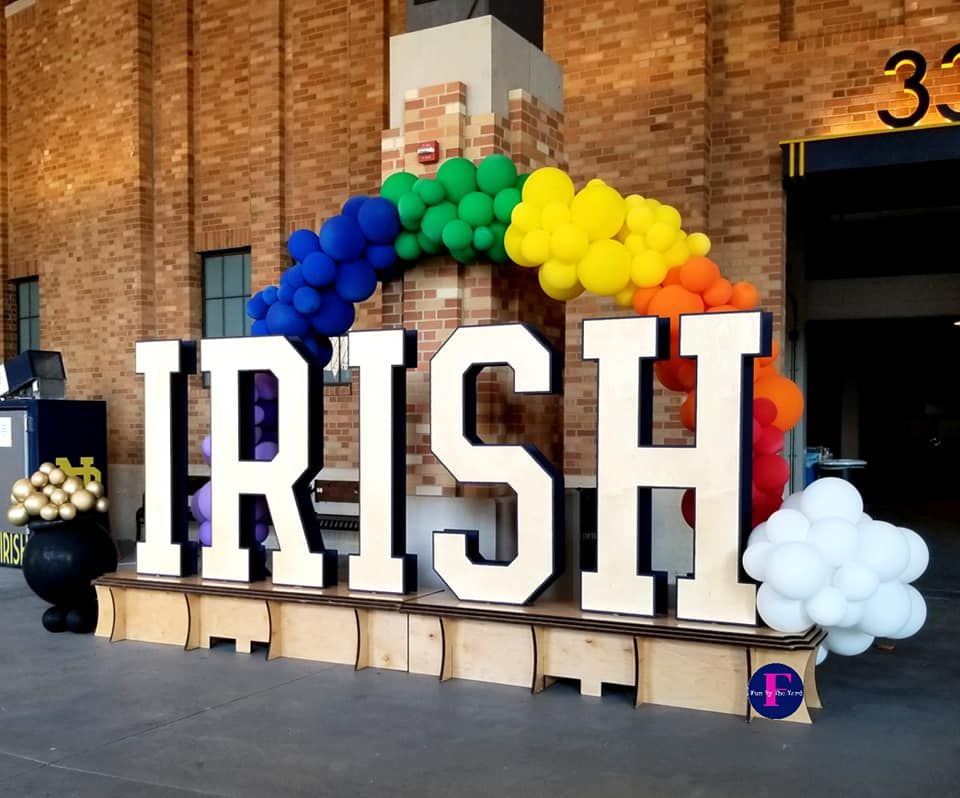 the word irish is surrounded by balloons and a rainbow