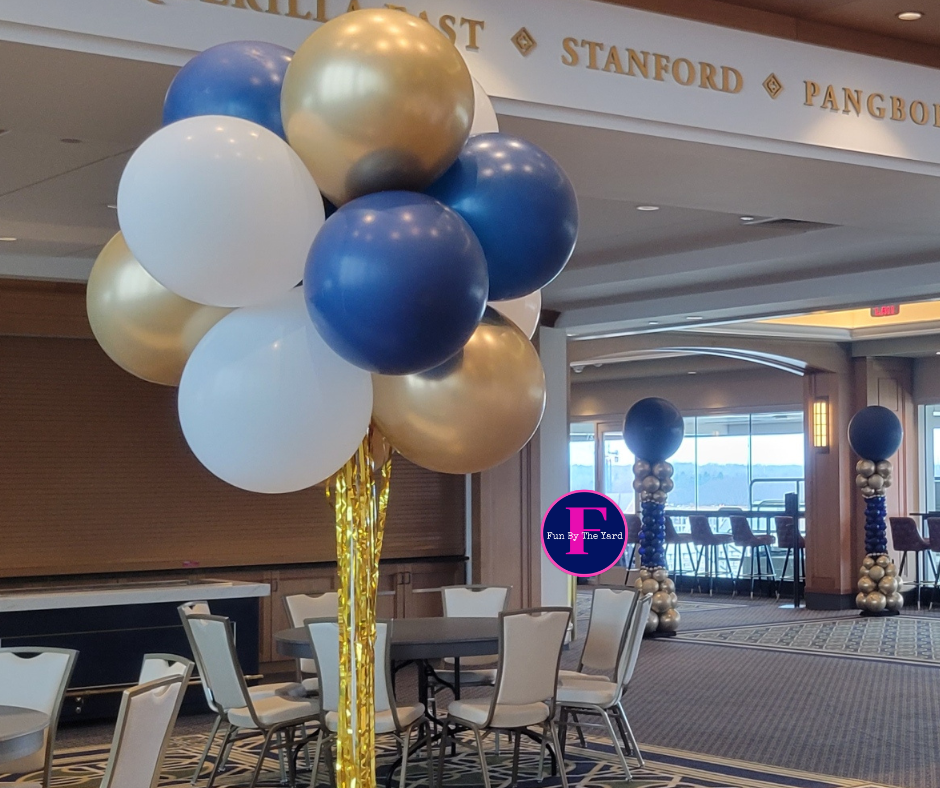 a bunch of balloons in a room with a sign that says stanford