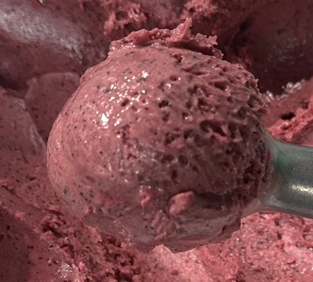 A close up of a scoop of ice cream on a table