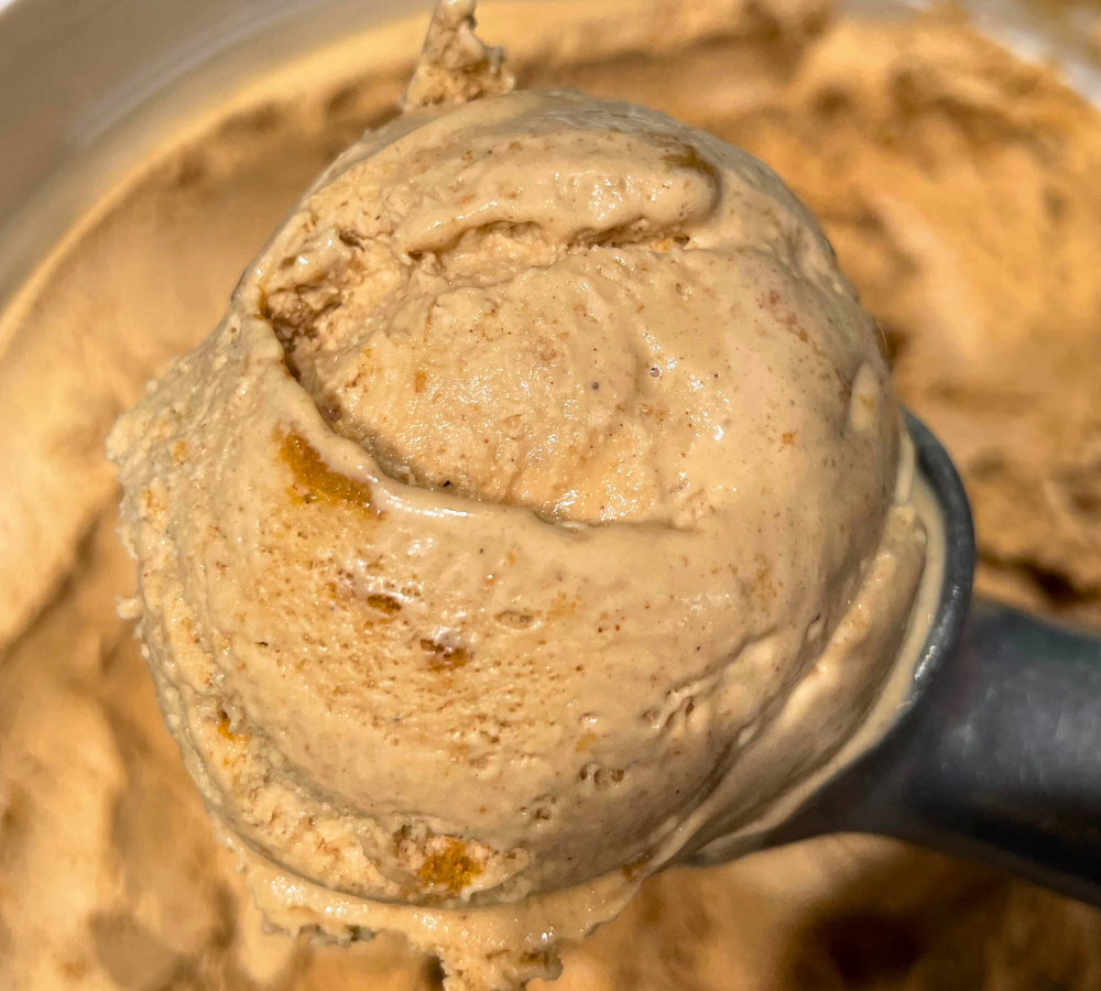 A close up of a scoop of ice cream on a table