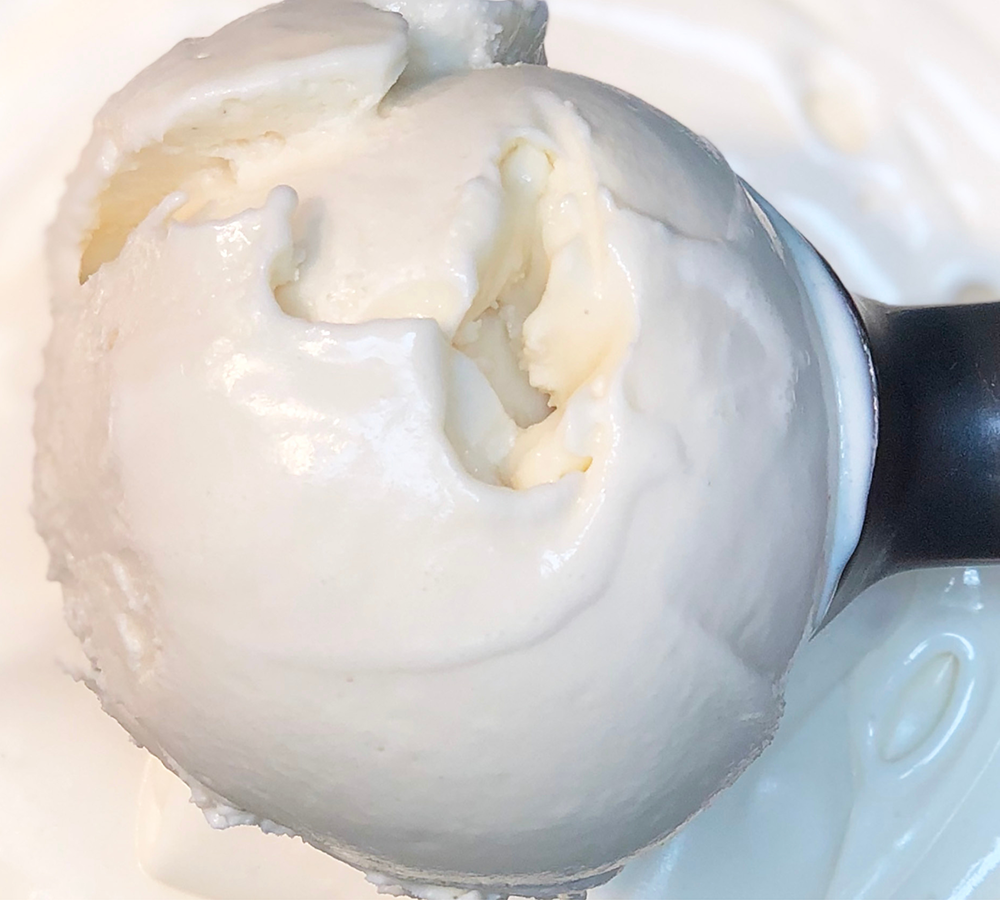 A close up of a scoop of ice cream on a table