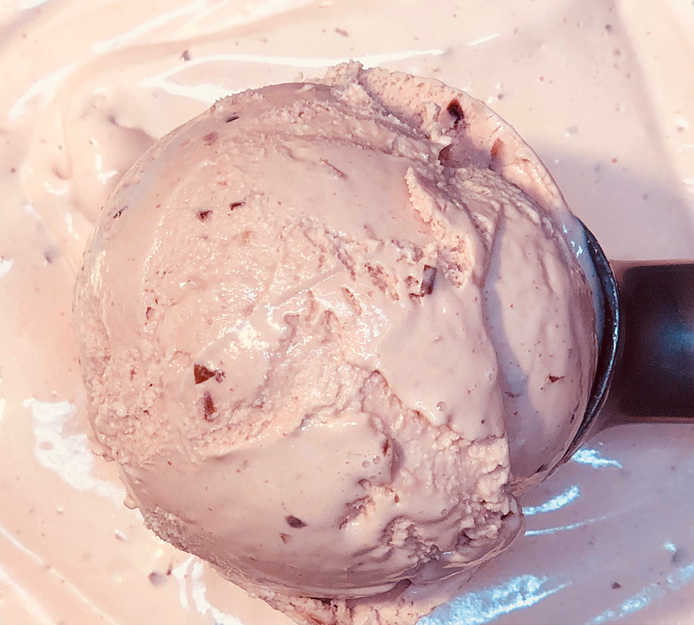 A close up of a scoop of ice cream on a table