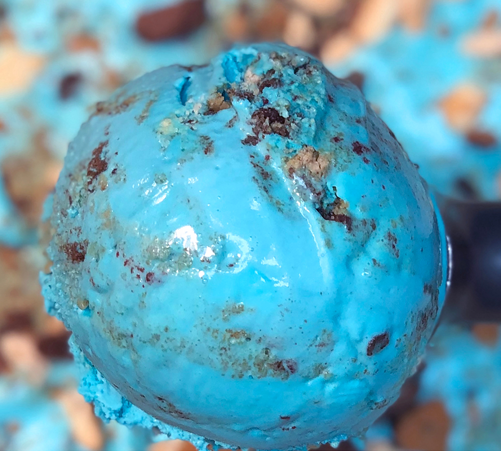 A close up of a scoop of ice cream on a table