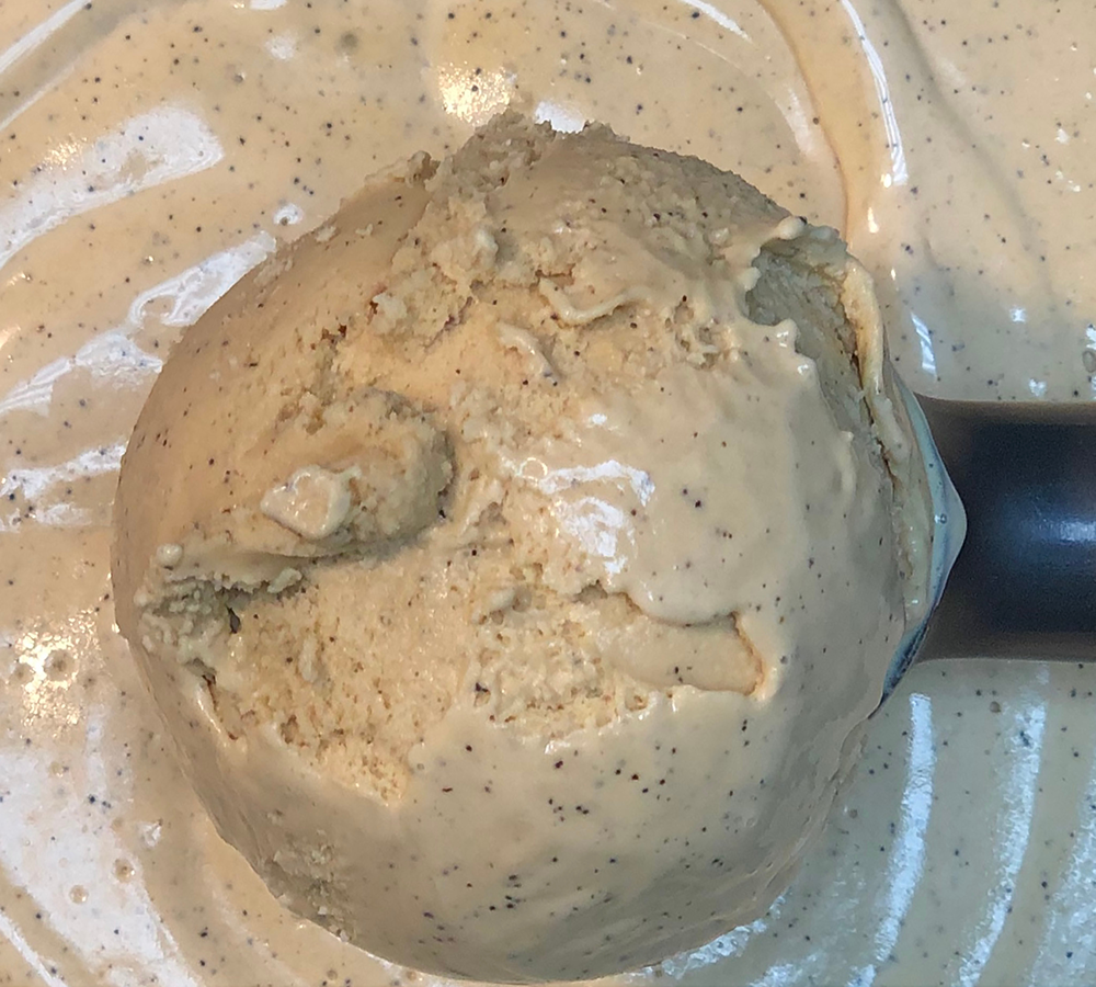 A close up of a scoop of ice cream on a table