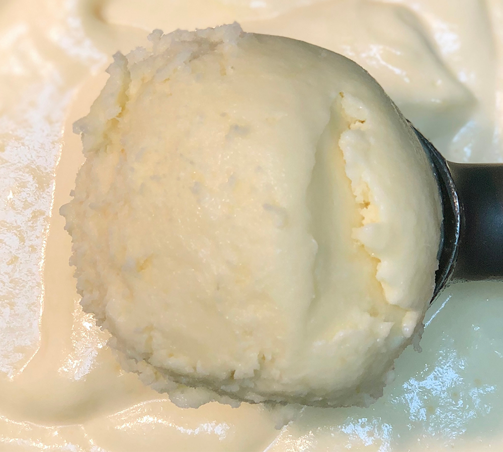 A close up of a scoop of ice cream on a table