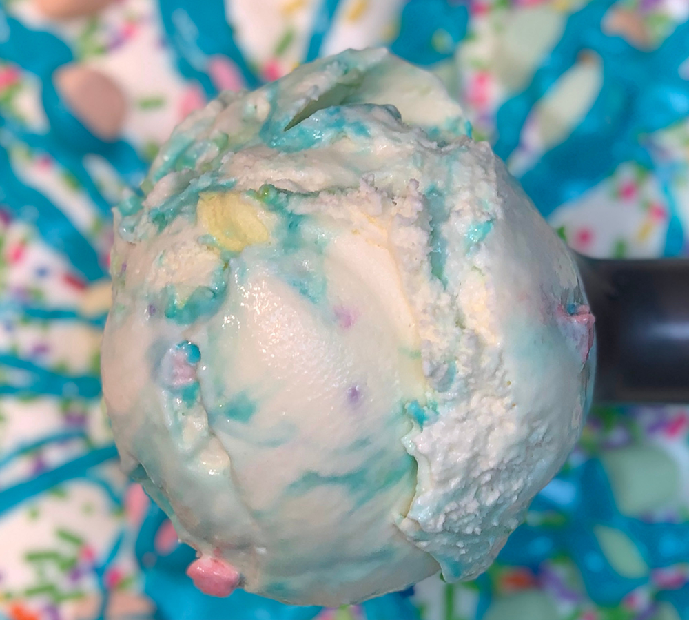 A close up of a scoop of ice cream on a table