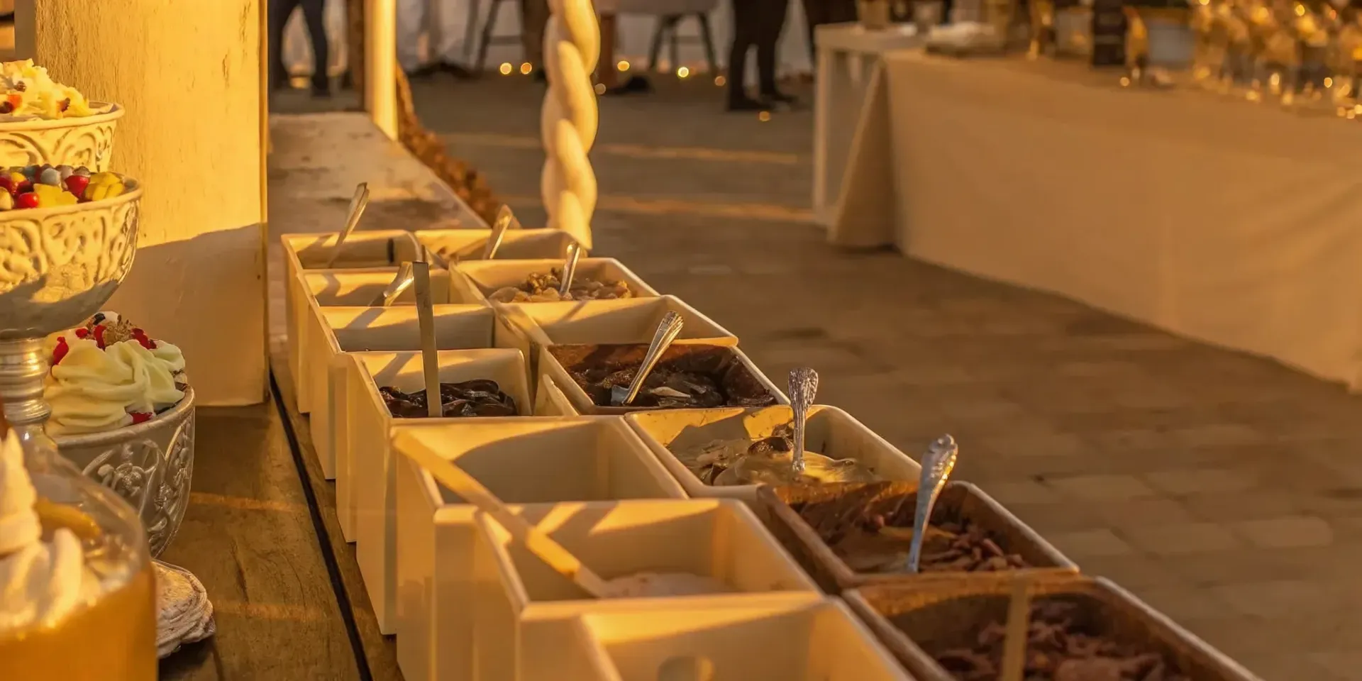 Ice cream sundae bar setup with handcrafted scoops and toppings at a wedding reception