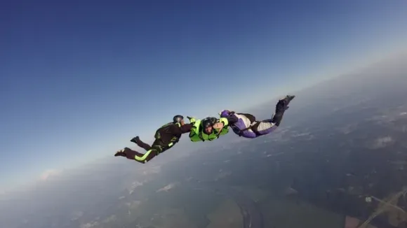 skydivers in freefall at kansas city dropzone during a beautiful summer day