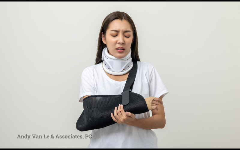 injured woman in a neck brace and arm sling