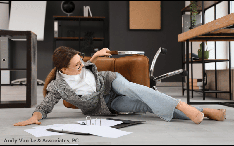woman slipped at work, lying on the floor injured