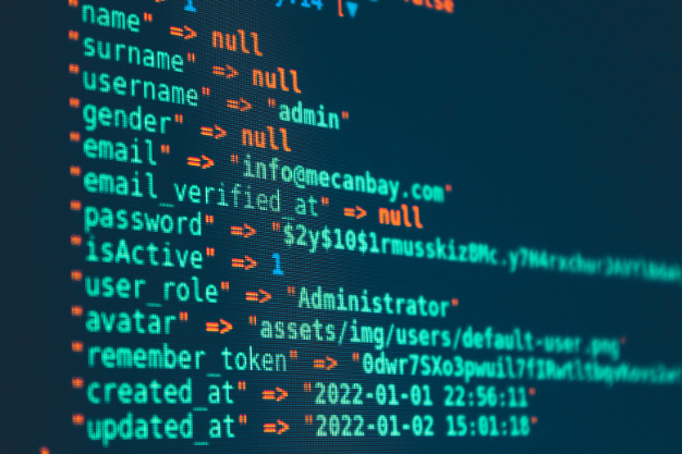 Code editor showing a user profile JSON with fields like name, email, and timestamps on a dark screen