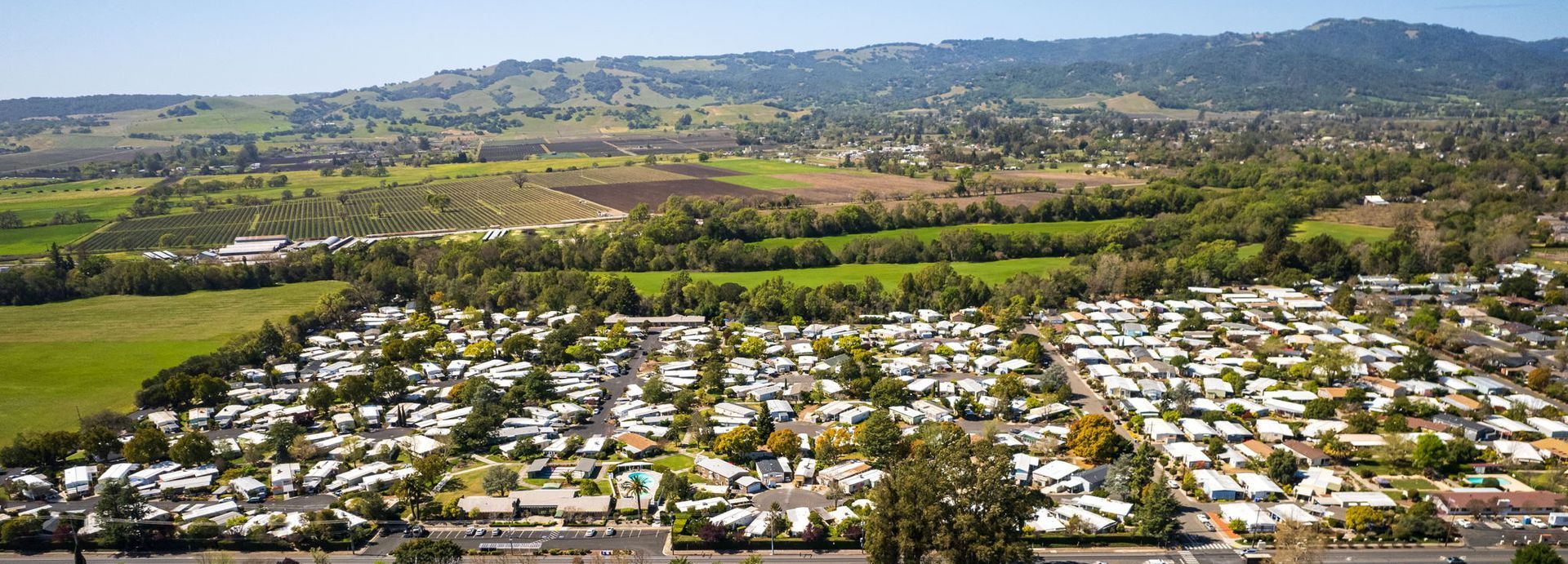 Aerial View of Moon Valley Community with Wine Country and hillside in background