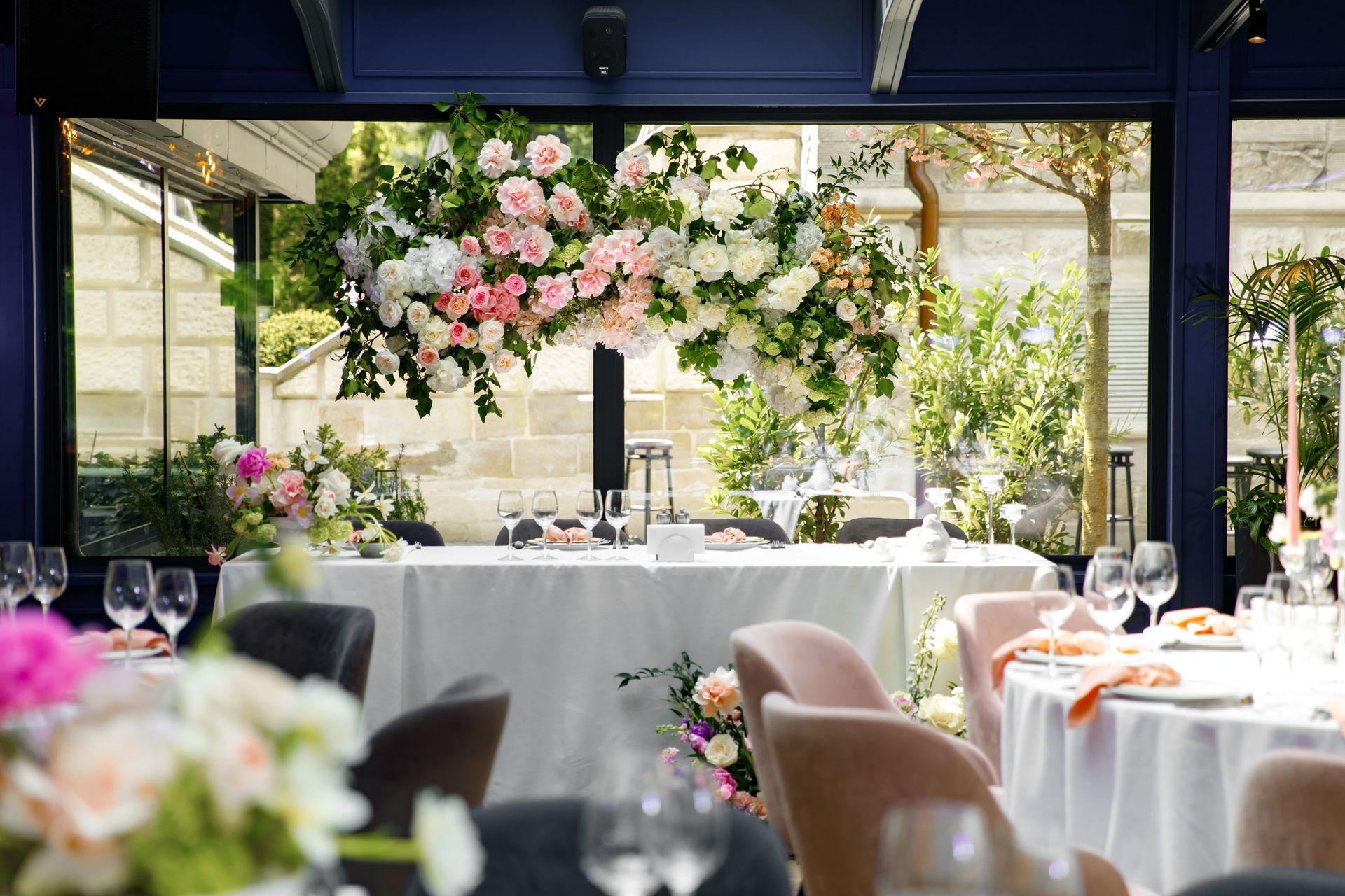 Wedding reception setup with floral arrangements and table settings