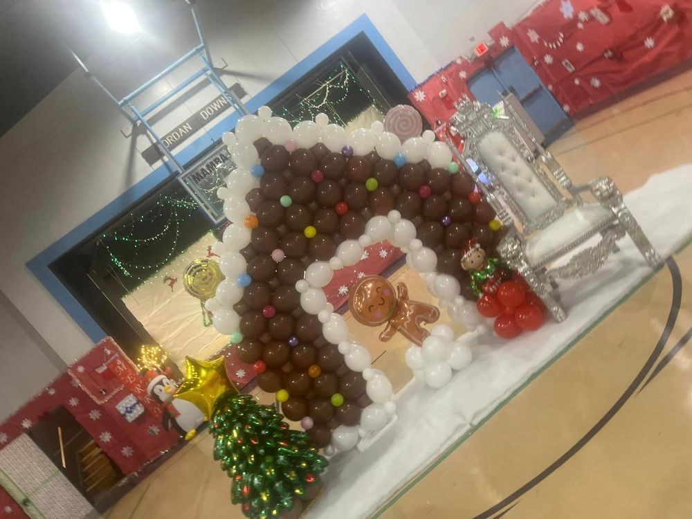Christmas-themed balloon house with gingerbread man