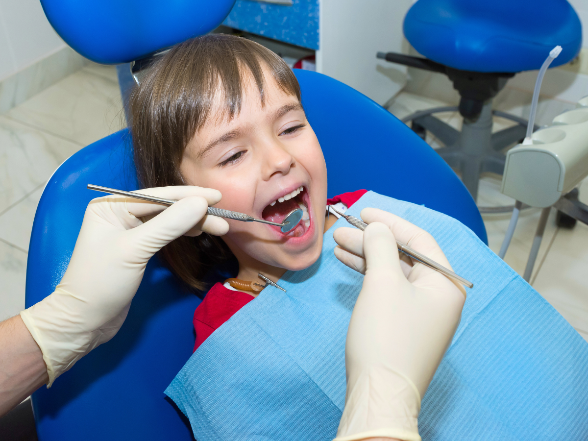 Kids dentist explaining space maintainers and early orthodontics at Westmount Dental Waterloo