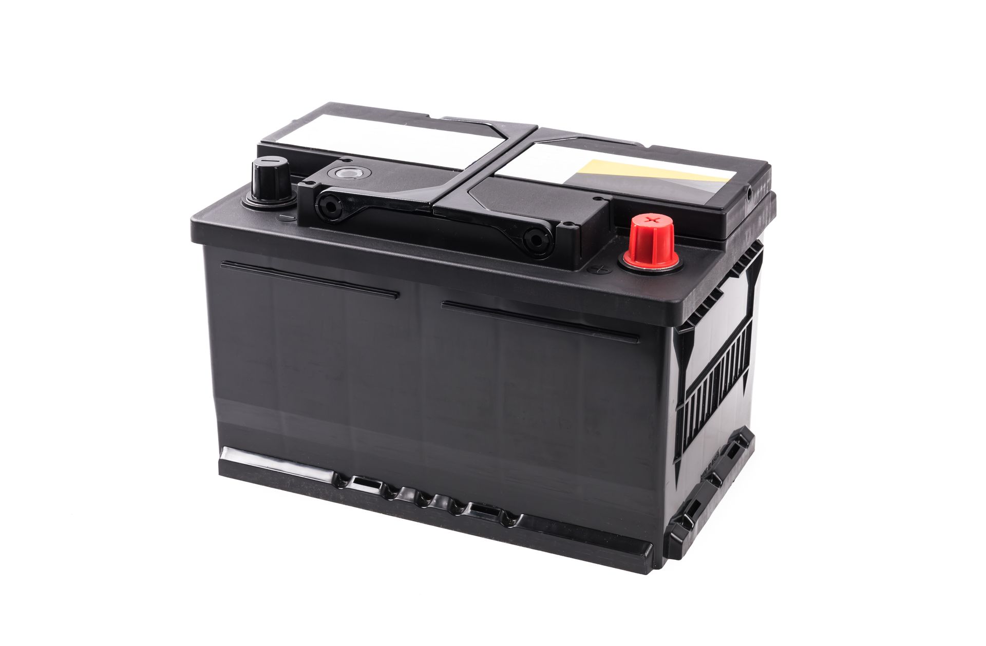 A commercial car battery isolated on a white background.