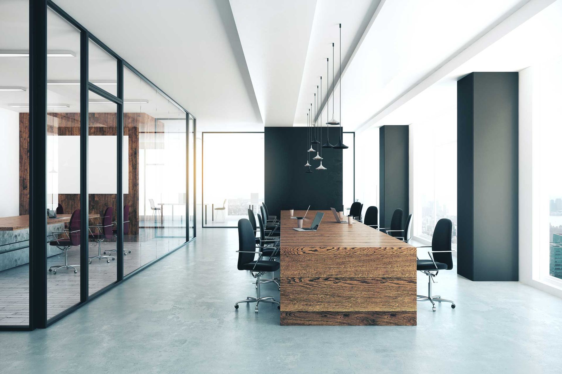 Modern office meeting room with long wooden table, black chairs, and glass walls. Modern office meeting room with long wooden table, black chairs, and glass walls.