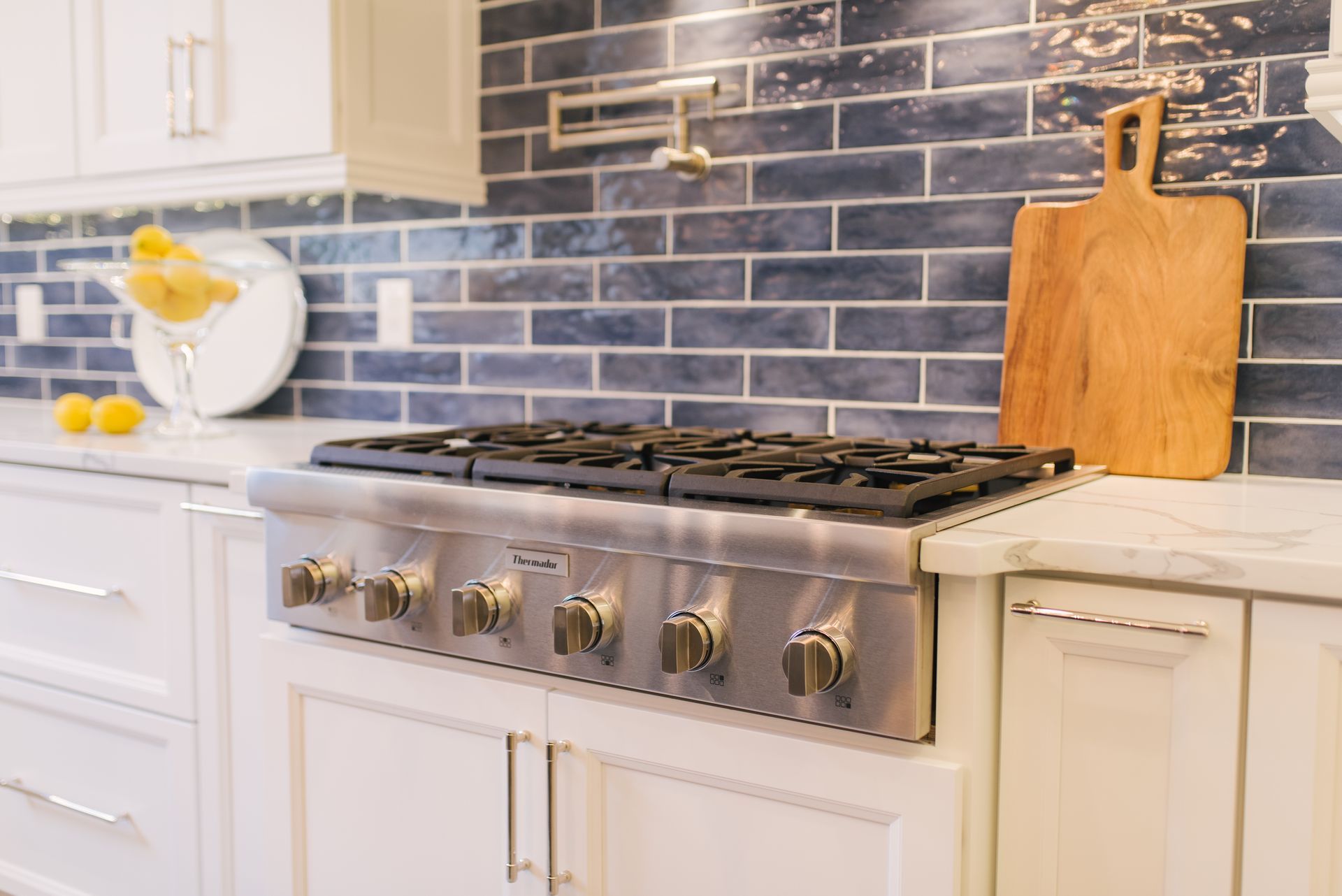 A stove top oven is sitting on top of a counter in a kitchen.