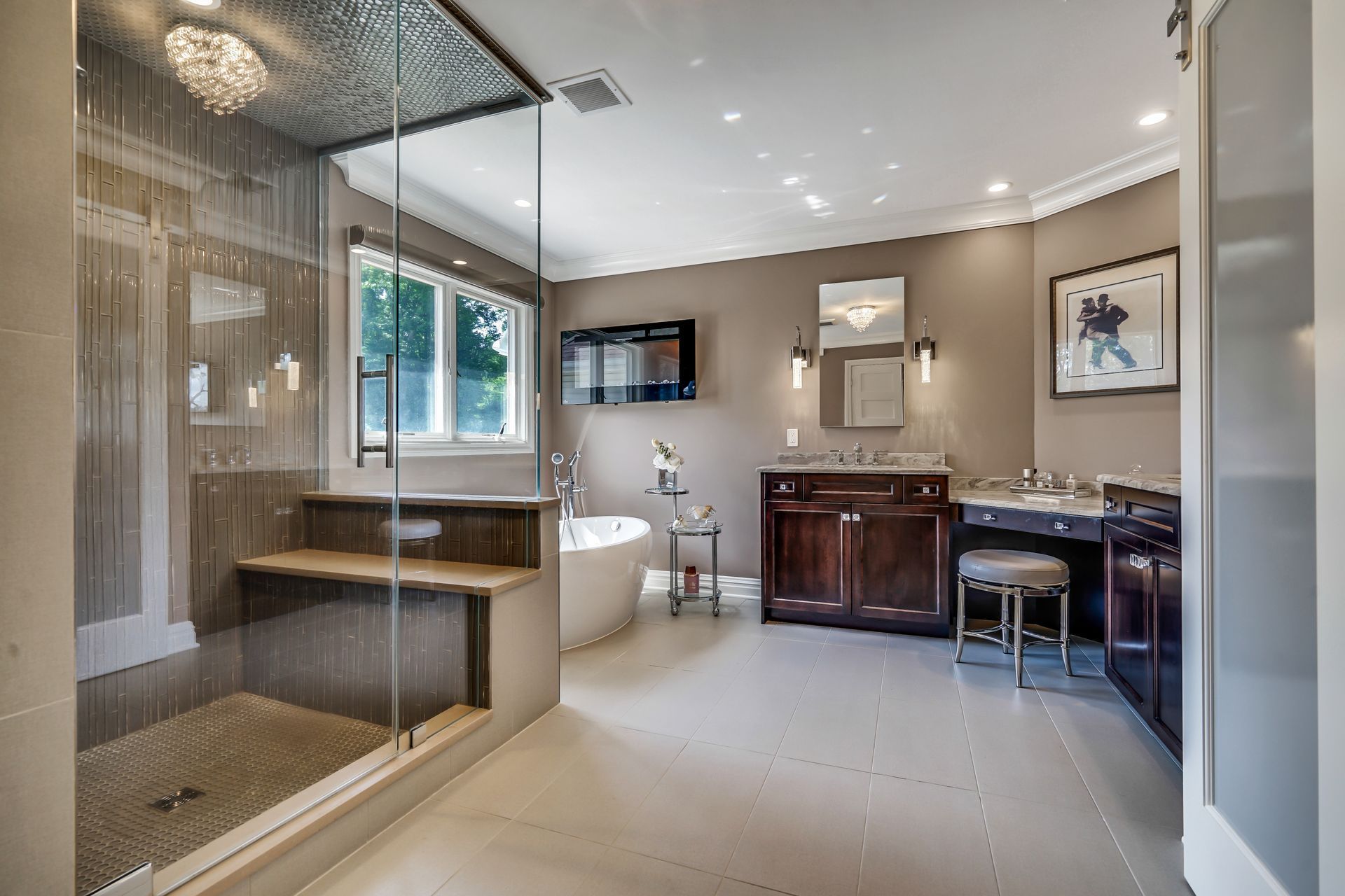 A bathroom with a bathtub and a walk in shower