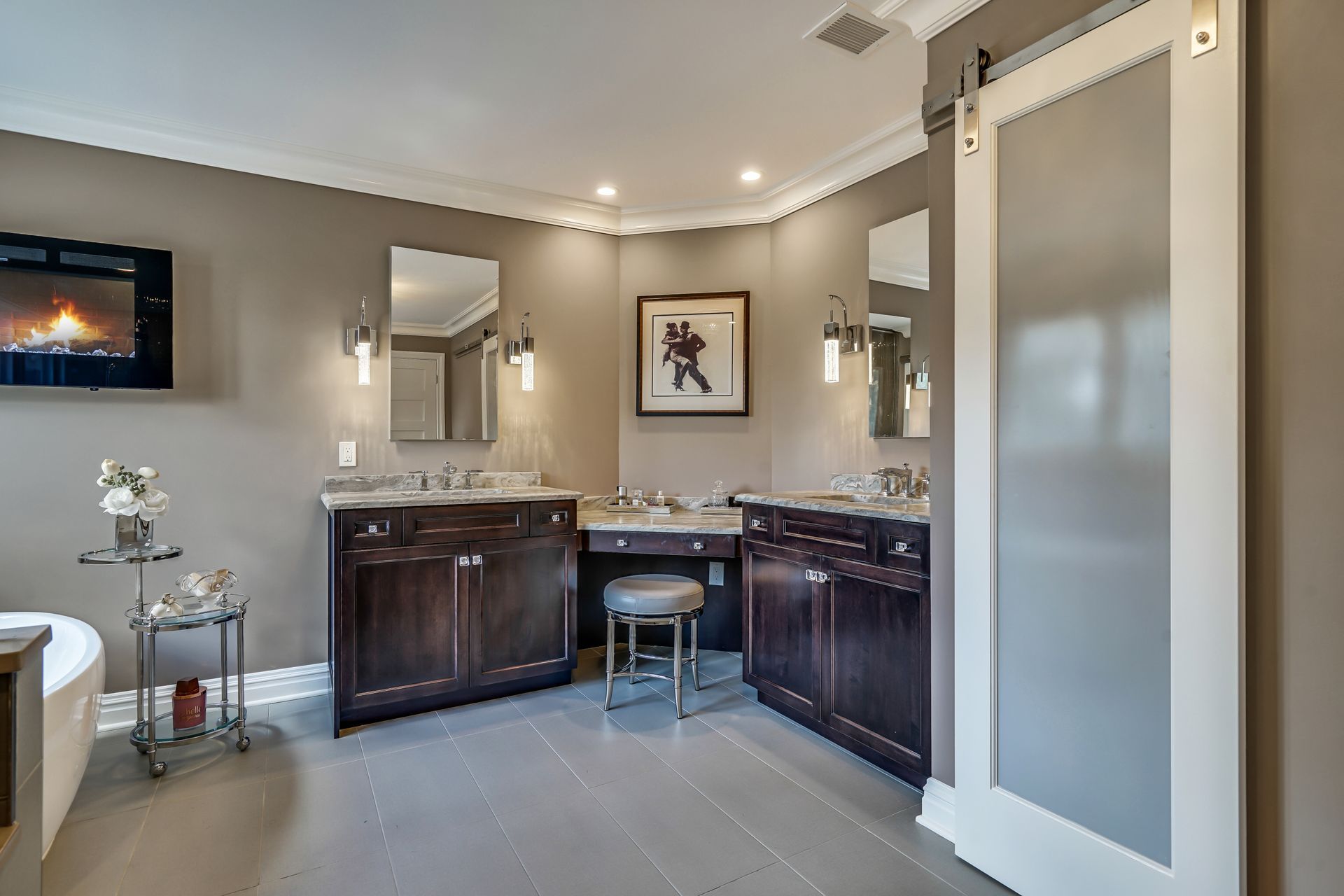 A bathroom with two sinks and a sliding glass door