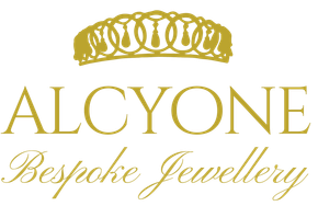 Gold logo for Alcyone Custom Made Jewellery featuring a stylized tiara above the text.