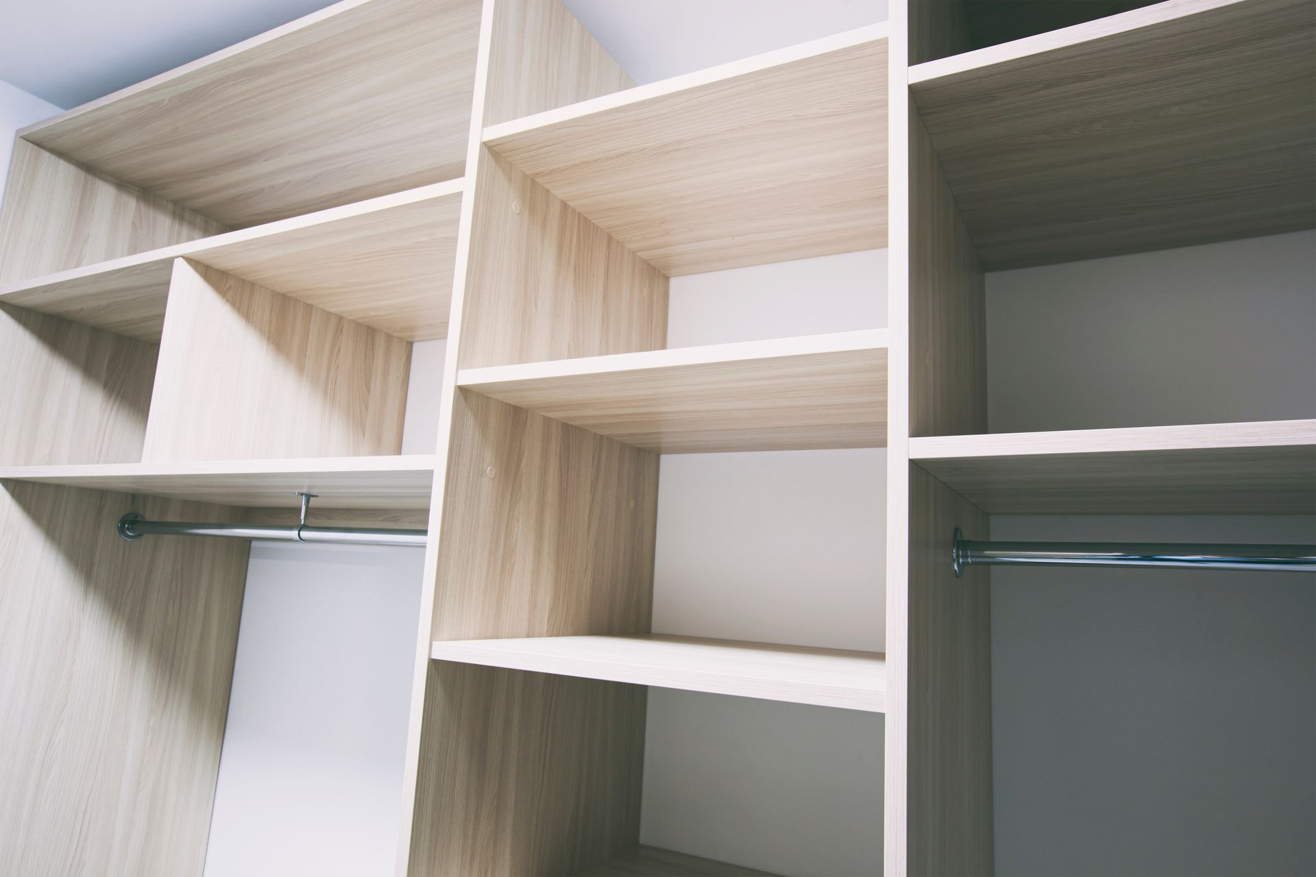 A Walk in Closet With Wooden Shelves and Clothes Racks — Pacific Cabinets In Iluka, NSW