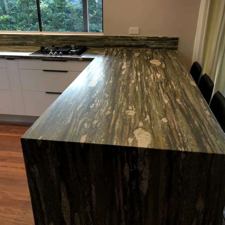 A Kitchen With a Large Granite Counter Top — Pacific Cabinets In Iluka, NSW