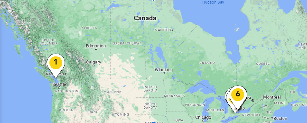 A map of canada with yellow pins on it.