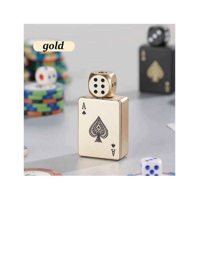 Gold dice-shaped lighter with spade symbol on a tabletop, with dice in the background