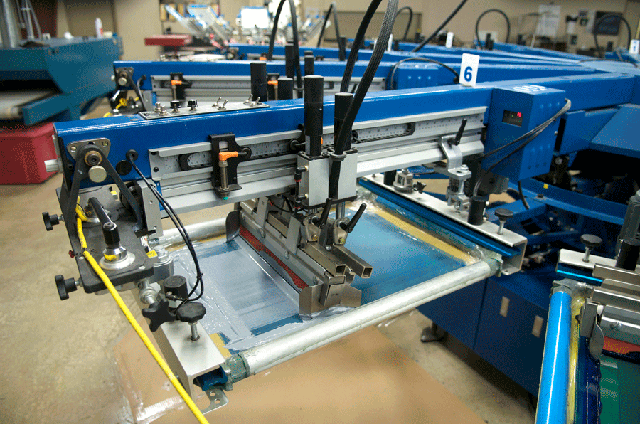 A Screen Printing Machine with The Number 6 on It