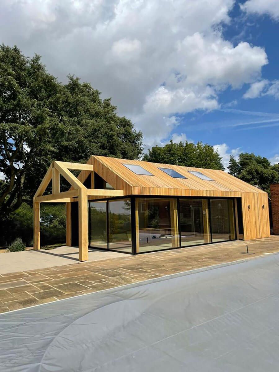 Timber built pool house with exposed & extruded timber frame construction