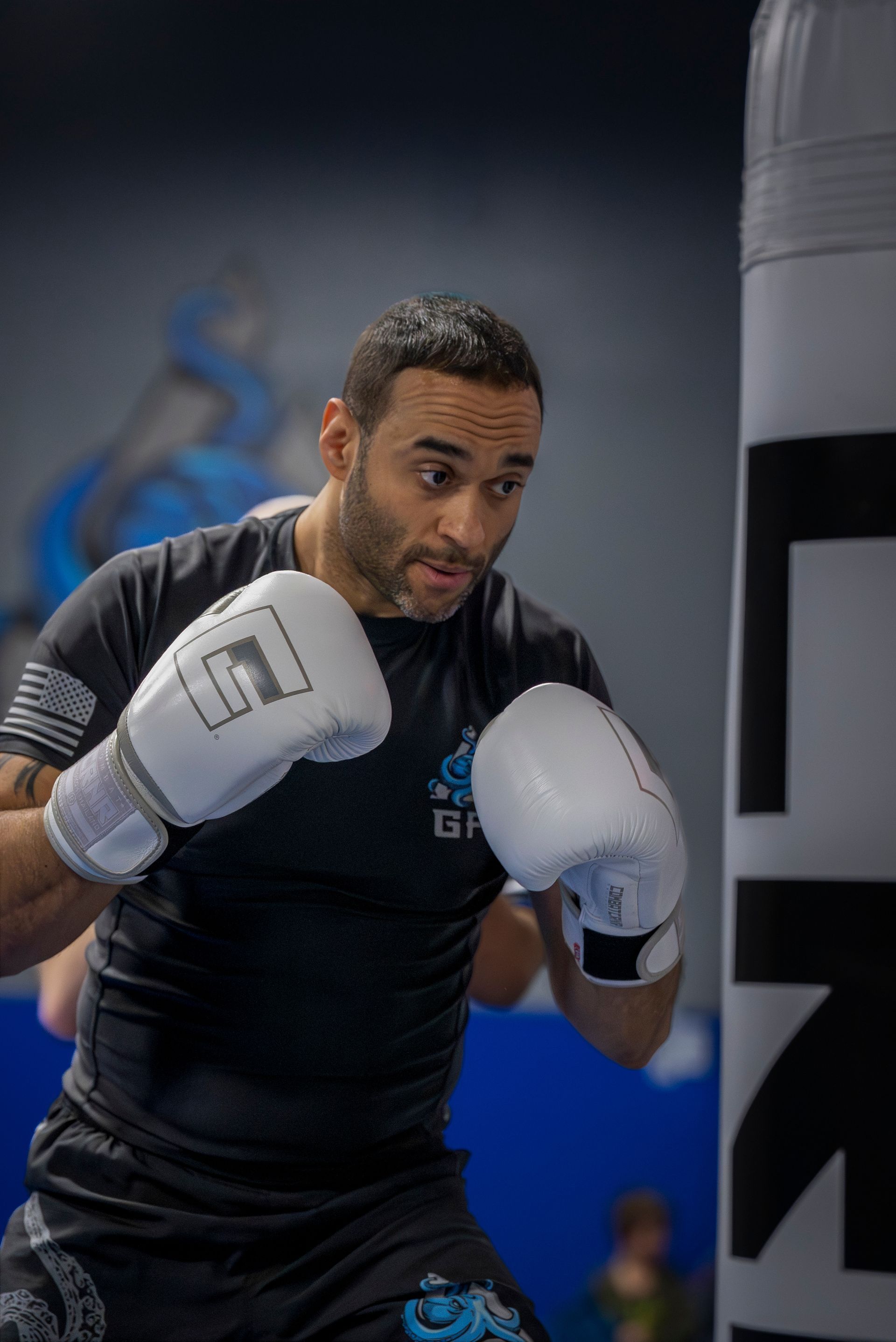 Adults training cardio kickboxing combos at Gracie Jiu-Jitsu Farmington Valley in Canton, CT.
