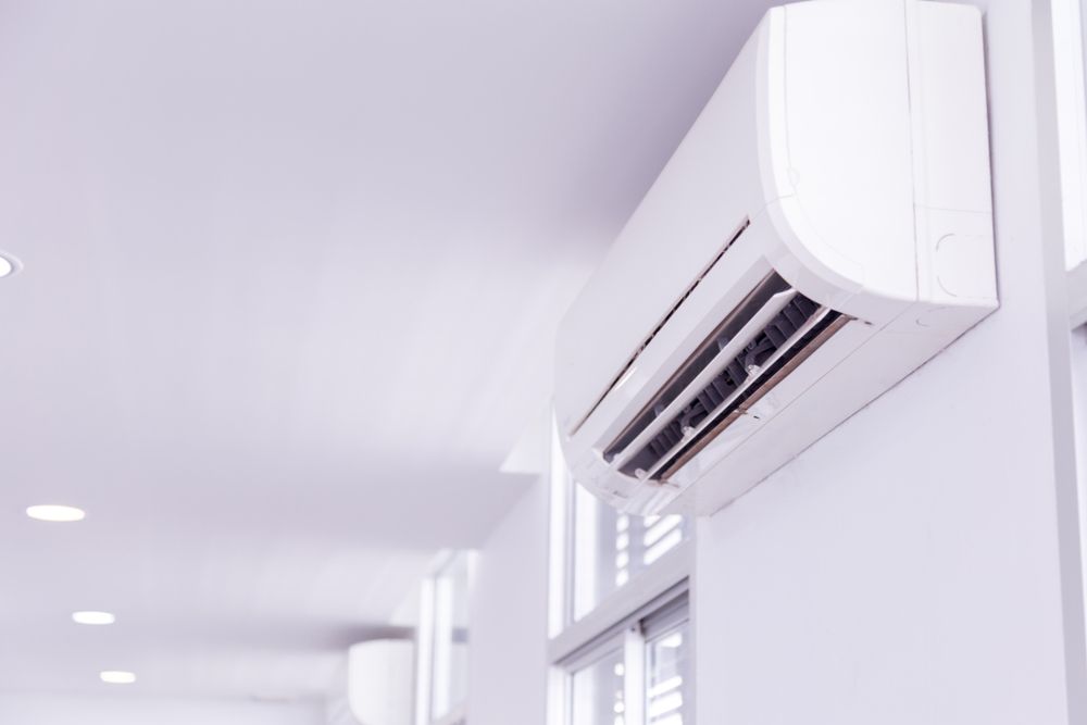 White Wall-mounted Air Conditioner in a Bright Hallway — Airweld Services Pty Ltd in Nowra, NSW