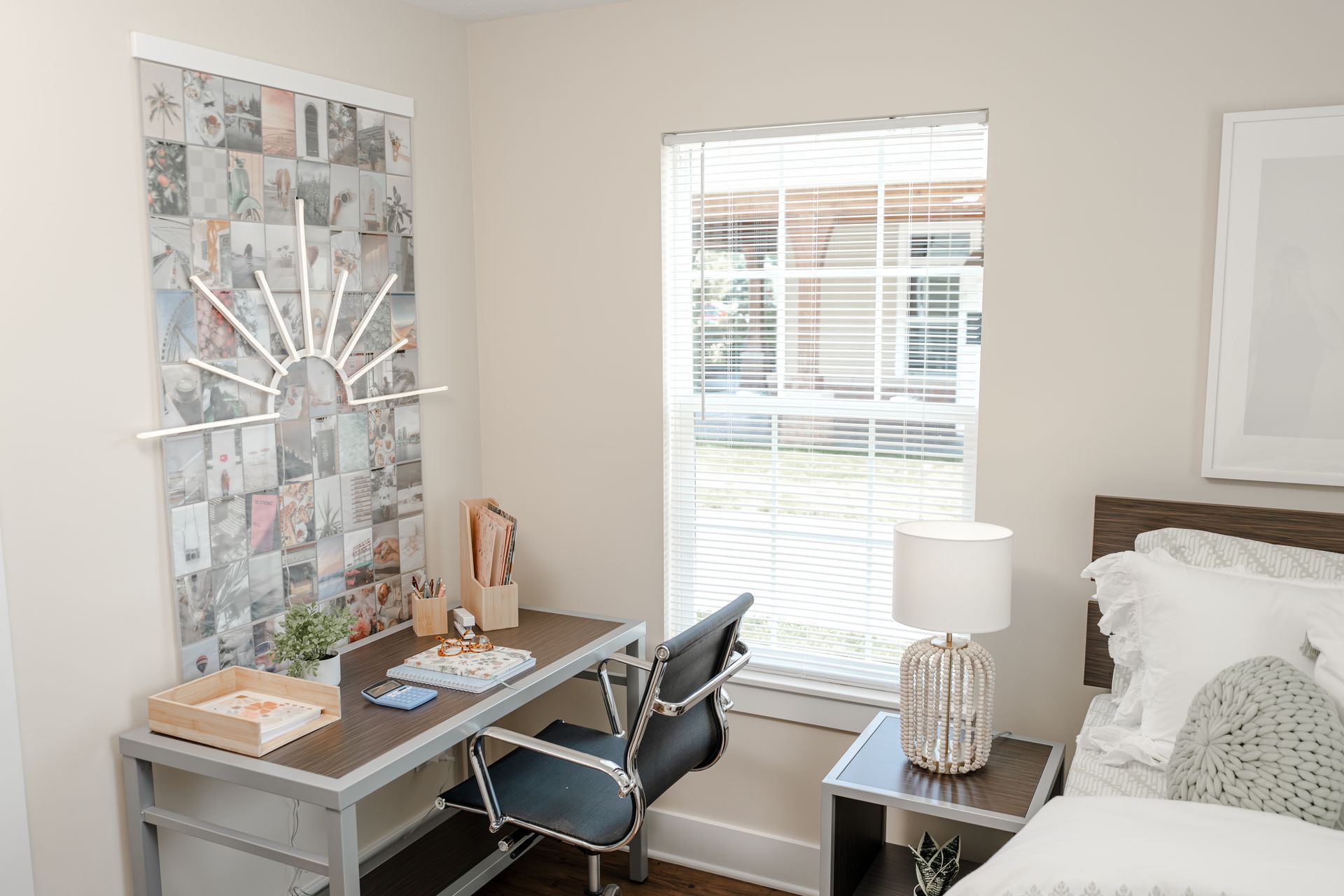 Bedroom with desk and bed near window. 