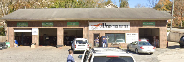 Autism center storefront with parked cars in front and brick facade