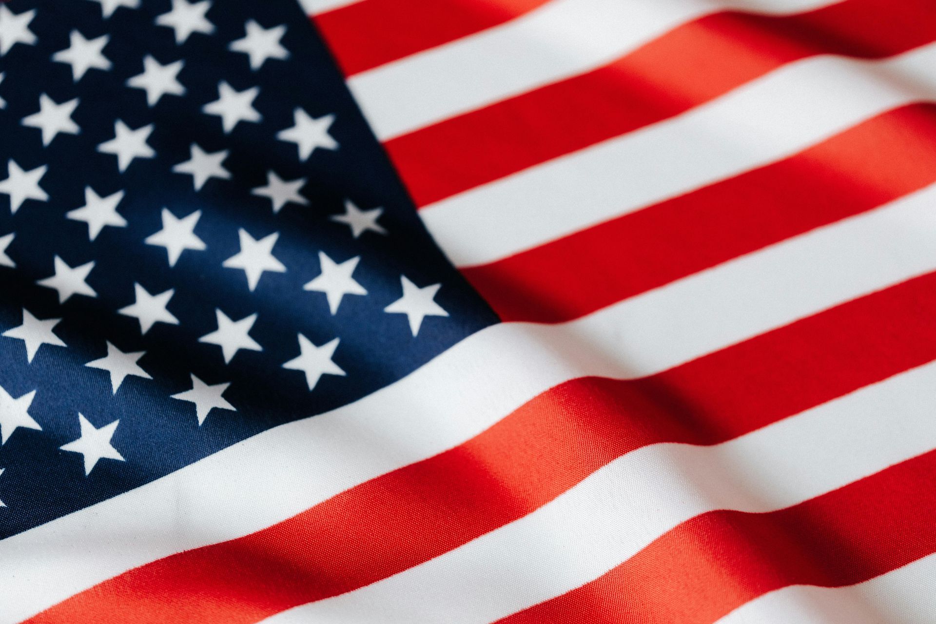 American flag, red and white stripes, blue field with white stars.