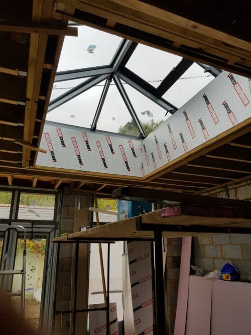 large skylight being installed in extension