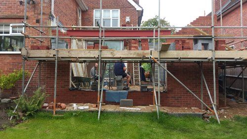 Large brick extension on side of residential property