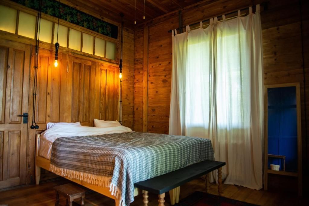 Comfortable king size bed in sea view room with modern linens, Shromantic Garden