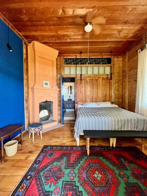Luxury king size bed and fireplace in sea view room, Shromantic Garden, Guria