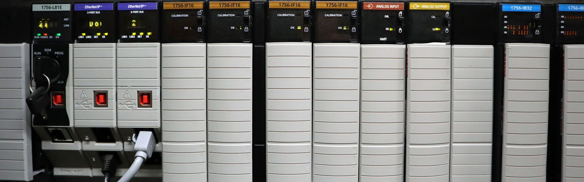 A bunch of electrical boxes are lined up in a row