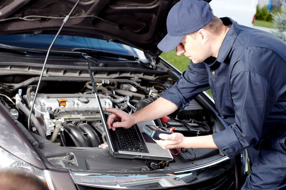 Mechanic Working In Auto Repair Service — Advanced Automotive Services In Earlville, QLD