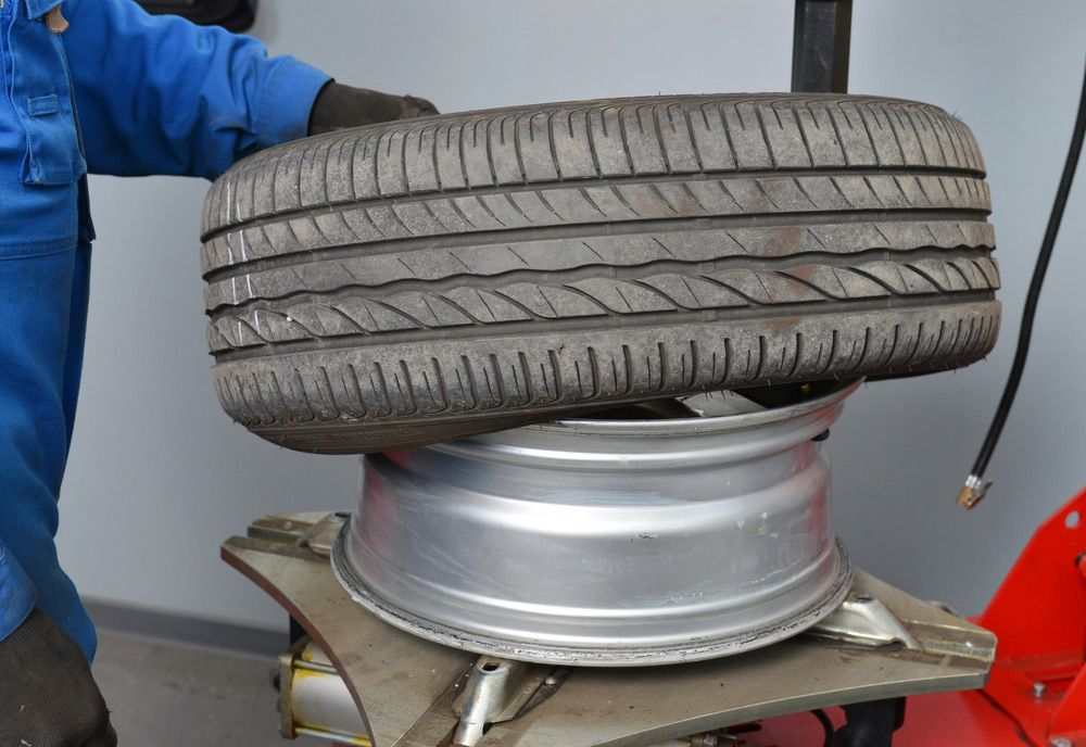 Tyre Replacement In Progress — Advanced Automotive Services In Earlville, QLD