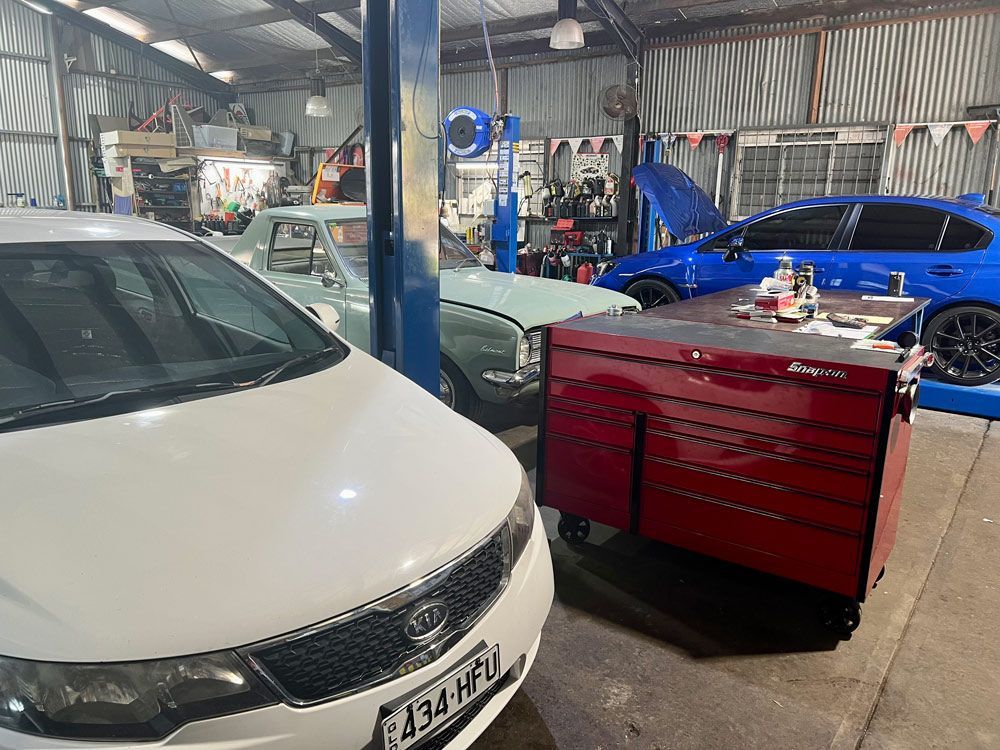 Different Cars Inside A Garage — Advanced Automotive Services In Earlville, QLD
