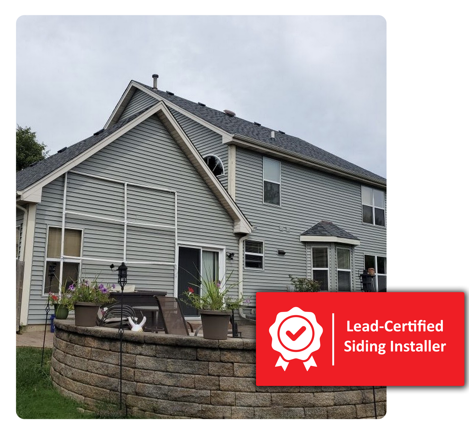 Gray house with patio and stone wall; Lead-Certified Siding Installer badge.